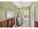 Utility room includes a water heater, window and door leading into the kitchen area at 123 14Th Ave, Indian Rocks Beach, FL 33785