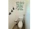 Cozy half-bath with unique starfish wall art and painted turtle decorations at 12300 4Th E St, Treasure Island, FL 33706