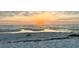 Seascape featuring a sandy beach at sunset, inviting for serene relaxation and quiet contemplation by the ocean at 12300 4Th E St, Treasure Island, FL 33706