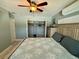 Charming bedroom featuring AC unit and a closet for storage and ladder access at 12300 4Th E St, Treasure Island, FL 33706