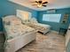 Bright and airy bedroom with two beds, AC unit, and stylish décor at 12300 4Th E St, Treasure Island, FL 33706