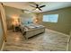Comfortable bedroom with fan, AC unit and bright stylish decor at 12300 4Th E St, Treasure Island, FL 33706