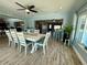 The open floorplan dining room looks into the living and kitchen areas at 12300 4Th E St, Treasure Island, FL 33706