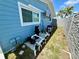 Outdoor home systems, including pool pump, are located between the house and a modern gray privacy fence at 12300 4Th E St, Treasure Island, FL 33706