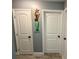 Hallway features a decorative mermaid wall art, leading to rooms with matching doors at 12300 4Th E St, Treasure Island, FL 33706