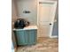 Olive green kitchen with a coffee bar and light countertops at 12300 4Th E St, Treasure Island, FL 33706