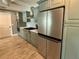 Kitchen featuring stainless steel appliances, grey cabinets, backsplash and light countertops at 12300 4Th E St, Treasure Island, FL 33706