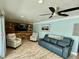 Comfortable living room features modern decor, wood accent wall, and neutral-toned furniture at 12300 4Th E St, Treasure Island, FL 33706