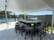 Outdoor bar with seating and a covered area, great for entertaining by the water at 12300 4Th E St, Treasure Island, FL 33706