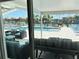 Beautiful backyard patio with ample seating and water views provides the perfect outdoor retreat at 12300 4Th E St, Treasure Island, FL 33706