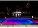 Backyard pool and spa feature color changing lights on a canal at 12300 4Th E St, Treasure Island, FL 33706