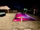 A luxurious in-ground pool and hot tub combination with a lounging area perfect for outdoor relaxation and gatherings at 12300 4Th E St, Treasure Island, FL 33706