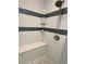 Shower with decorative tile and built-in corner shelves at 12300 4Th E St, Treasure Island, FL 33706