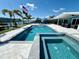 Gorgeous pool and spa combo overlooking the canal, perfect for a relaxing Florida lifestyle at 12300 4Th E St, Treasure Island, FL 33706