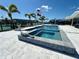 Spectacular swimming pool and hot tub with canal views and an alligator statue at 12300 4Th E St, Treasure Island, FL 33706