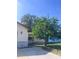 Inviting one-story home with a well-manicured lawn and mature trees at 12801 Winding Way, Hudson, FL 34667