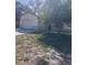 Single-Gathering home featuring an attached garage and a front yard, all under a bright, sunny sky at 12801 Winding Way, Hudson, FL 34667