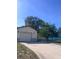 Single story home with a driveway and a well-maintained yard at 12801 Winding Way, Hudson, FL 34667