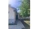 Welcoming one-story home with a dark front door and a well-maintained front yard at 12801 Winding Way, Hudson, FL 34667