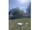 A charming single-story home with a well-maintained lawn and mature trees at 12801 Winding Way, Hudson, FL 34667