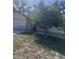 Single-Gathering home featuring an attached garage and a front yard, all under a bright, sunny sky at 12801 Winding Way, Hudson, FL 34667