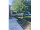 Charming home exterior with mature tree, sidewalk, and well-maintained lawn at 12801 Winding Way, Hudson, FL 34667