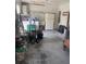 Large garage with a washer, dryer, utility sink, and fridge at 12801 Winding Way, Hudson, FL 34667