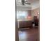Spacious eat-in kitchen with wooden cabinets, wood flooring, and a garden view window at 12801 Winding Way, Hudson, FL 34667
