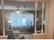 Cozy living room featuring neutral color palette, natural light, and decorative pillars at 12801 Winding Way, Hudson, FL 34667