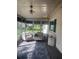 Sunroom patio featuring neutral colored furniture and nice flooring at 12801 Winding Way, Hudson, FL 34667