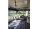 Inviting sunroom with neutral tones, plush swivel chairs, and natural light, creating a cozy and relaxing atmosphere at 12801 Winding Way, Hudson, FL 34667
