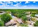 Aerial view of the community with mature trees and a scenic pond at 12910 Leadwood Dr, Riverview, FL 33579