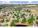 Neighborhood aerial view featuring a pond and tree-lined streets at 12910 Leadwood Dr, Riverview, FL 33579