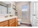 Bathroom featuring wood-look floors, wood vanity, and a shower-tub combination at 12910 Leadwood Dr, Riverview, FL 33579