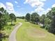 Scenic view of the community golf course with well-manicured greens at 12910 Leadwood Dr, Riverview, FL 33579