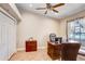 Comfortable home office with wood floors, a desk, and ample storage space at 12910 Leadwood Dr, Riverview, FL 33579