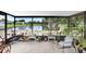 Screened patio featuring lush plants and a serene view of the pond at 12910 Leadwood Dr, Riverview, FL 33579