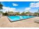 Inviting community pool area with ample seating and shaded lounging spaces at 12910 Leadwood Dr, Riverview, FL 33579