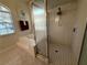 Modern bathroom featuring a glass-enclosed shower and a large tub at 13133 Roseanna Dr, Spring Hill, FL 34609