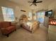 Well-lit bedroom with elegant decor and an exterior view of the screened-in porch at 13133 Roseanna Dr, Spring Hill, FL 34609
