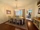 Inviting dining room with hardwood floors and a chandelier above a table setting at 13133 Roseanna Dr, Spring Hill, FL 34609