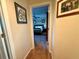 Inviting hallway leading to a comfortable bedroom, creating a seamless transition within the home at 13133 Roseanna Dr, Spring Hill, FL 34609