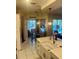 Charming eat-in kitchen area with updated countertops, pendant lighting, and cozy breakfast nook overlooking pool at 13133 Roseanna Dr, Spring Hill, FL 34609