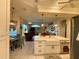 Bright kitchen featuring a large island with sink, stainless steel appliances and white cabinets at 13133 Roseanna Dr, Spring Hill, FL 34609