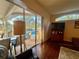 Bright living room with an open layout, seamlessly connecting to the outdoor pool area through sliding glass doors at 13133 Roseanna Dr, Spring Hill, FL 34609