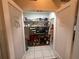 Walk-in pantry with shelving and tiled flooring at 13133 Roseanna Dr, Spring Hill, FL 34609