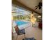 Screened-in pool area with lounge chairs, providing a serene outdoor experience at 13133 Roseanna Dr, Spring Hill, FL 34609