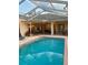 Inviting backyard pool and patio area, perfect for relaxation and outdoor entertaining at 13133 Roseanna Dr, Spring Hill, FL 34609