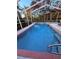 Relaxing in-ground pool with screened-in enclosure and ladder access at 13133 Roseanna Dr, Spring Hill, FL 34609