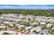 Aerial view showcases a vibrant waterfront community with waterways and neatly arranged mobile homes at 134 W Saint Annes Cir, Apollo Beach, FL 33572